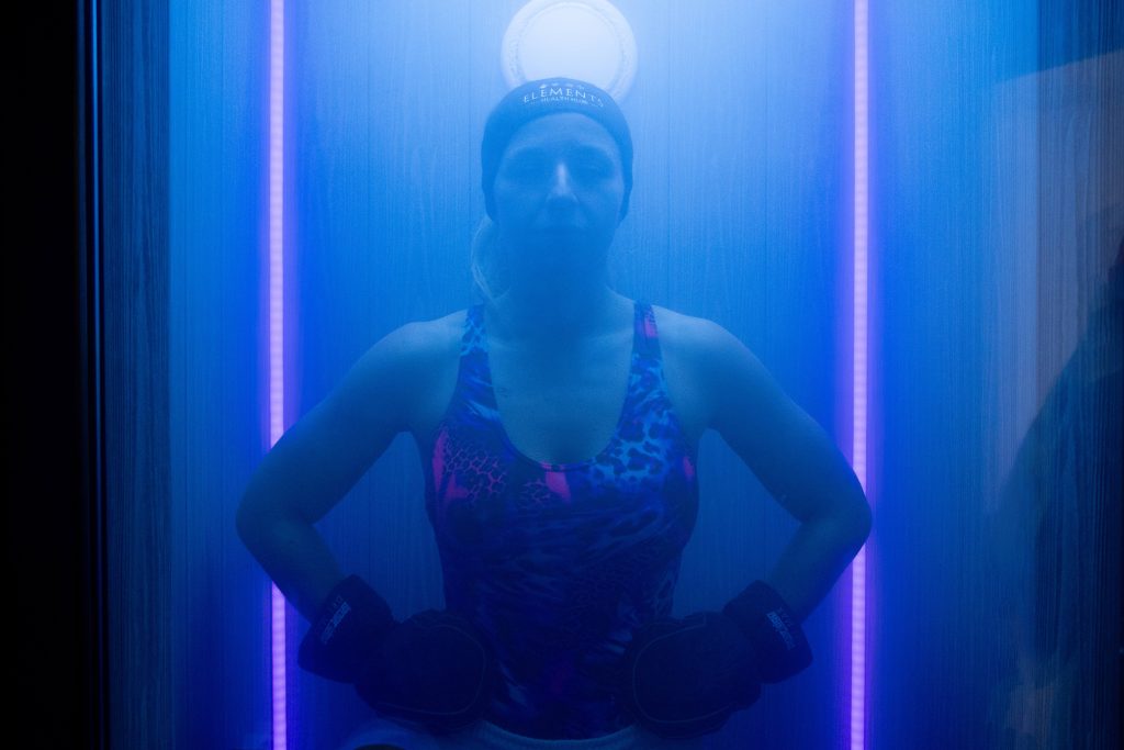 Woman in cryotherapy chamber